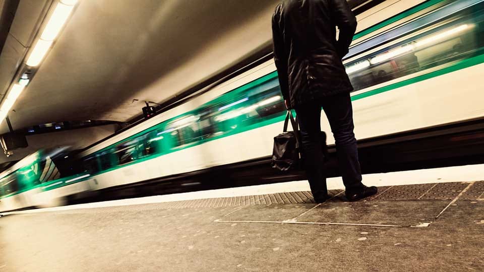 Man standing in Paris Metro