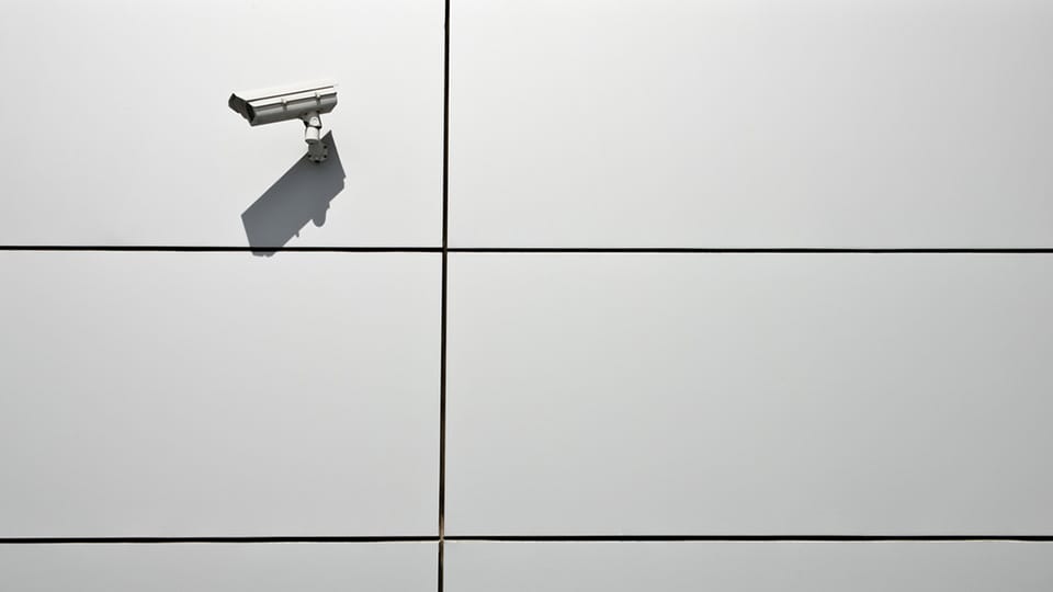 Security camera on a wall